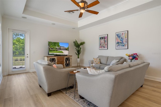 27318 Sora Blvd, Wesley Chapel, FL 33544 - living room with light wood-style floors, visible vents, crown molding, and ceiling fan