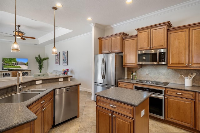 27318 Sora Blvd, Wesley Chapel, FL 33544 - kitchen with crown molding, dark countertops, a sink, stainless steel appliances, and brown cabinets