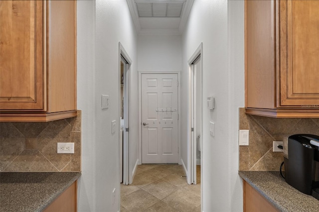 27318 Sora Blvd, Wesley Chapel, FL 33544 - hallway with crown molding, baseboards, and light tile patterned floors