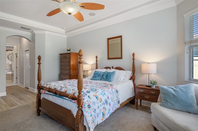 27318 Sora Blvd, Wesley Chapel, FL 33544 - bedroom featuring visible vents, baseboards, arched walkways, ceiling fan, and crown molding