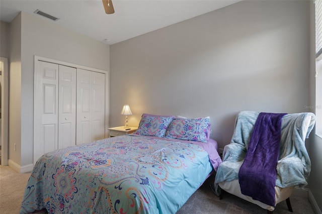 27318 Sora Blvd, Wesley Chapel, FL 33544 - carpeted bedroom with visible vents, baseboards, a ceiling fan, and a closet