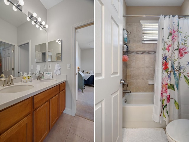 27318 Sora Blvd, Wesley Chapel, FL 33544 - full bathroom featuring double vanity, tile patterned floors, shower / bath combo with shower curtain, and a sink