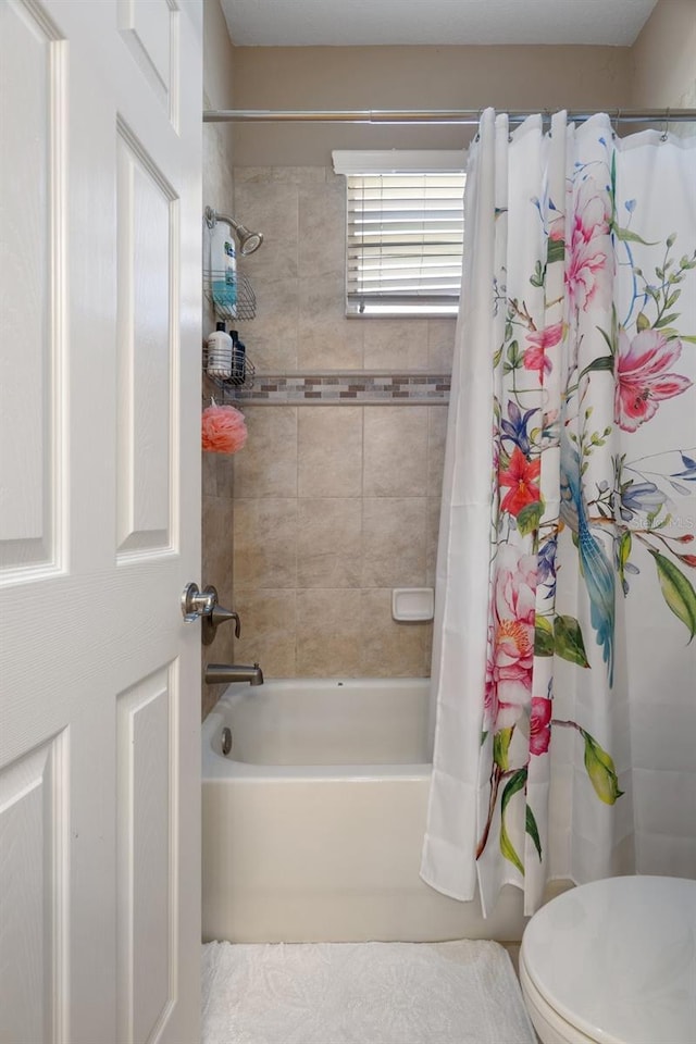 27318 Sora Blvd, Wesley Chapel, FL 33544 - bathroom featuring shower / bath combo, tile patterned flooring, and toilet