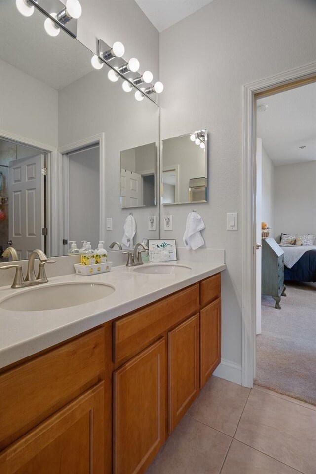 27318 Sora Blvd, Wesley Chapel, FL 33544 - ensuite bathroom featuring tile patterned flooring, double vanity, ensuite bathroom, and a sink