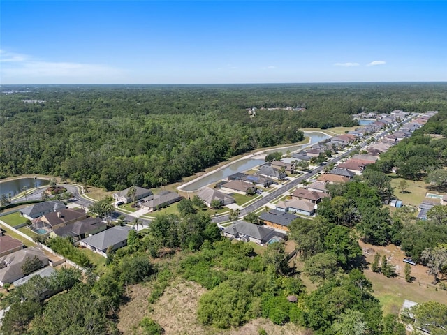 27318 Sora Blvd, Wesley Chapel, FL 33544 - birds eye view of property featuring a water view, a residential view, and a wooded view