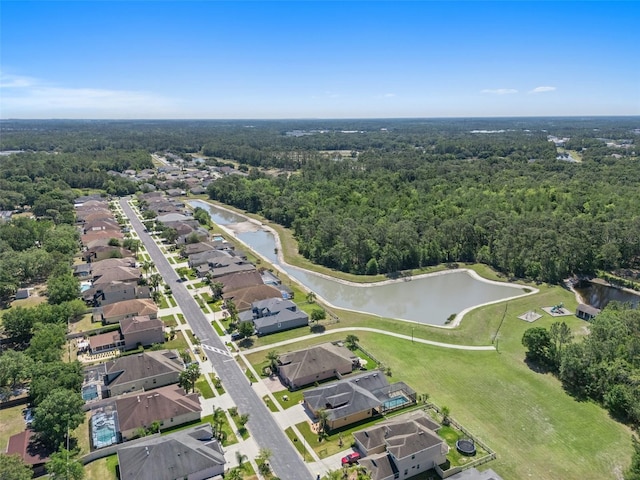 27318 Sora Blvd, Wesley Chapel, FL 33544 - drone / aerial view with a view of trees, a residential view, and a water view
