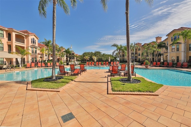 2739 Via Capri Unit 1024, Clearwater, FL 33764 - community pool featuring a residential view and a patio