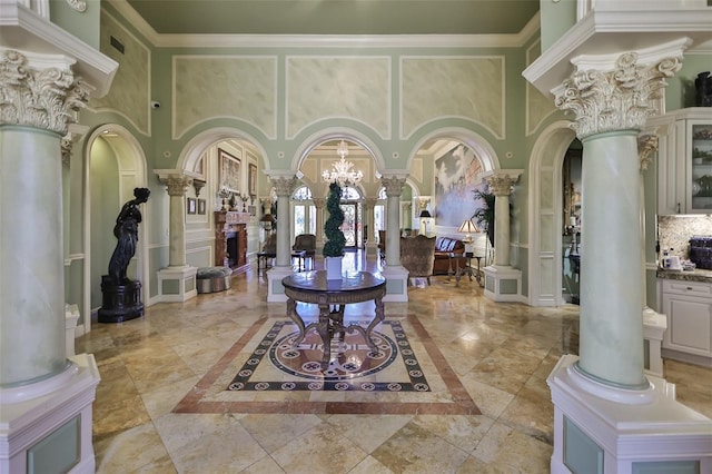 2739 Via Capri Unit 1024, Clearwater, FL 33764 - common area with a towering ceiling and crown molding