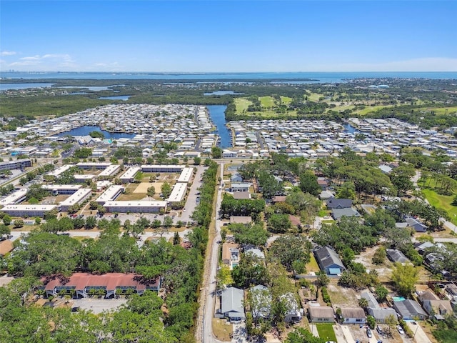 drone / aerial view featuring a residential view and a water view