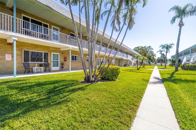 surrounding community featuring a lawn