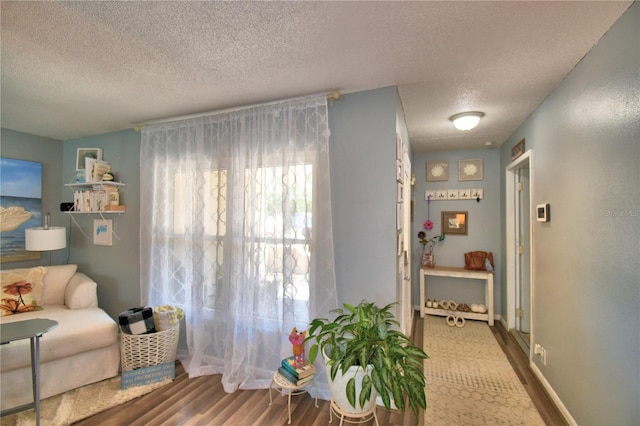 53 Paine Dr, Winter Haven, FL 33884 - living area with baseboards, wood finished floors, and a textured ceiling
