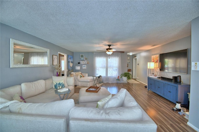 53 Paine Dr, Winter Haven, FL 33884 - living area featuring dark wood finished floors, a textured ceiling, and ceiling fan