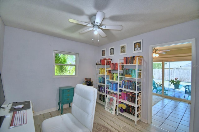 53 Paine Dr, Winter Haven, FL 33884 - living area with a wealth of natural light, a ceiling fan, wood tiled floor, and baseboards