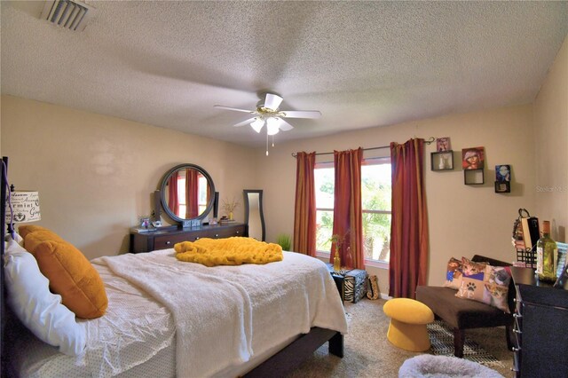 53 Paine Dr, Winter Haven, FL 33884 - carpeted bedroom with a textured ceiling, visible vents, and a ceiling fan
