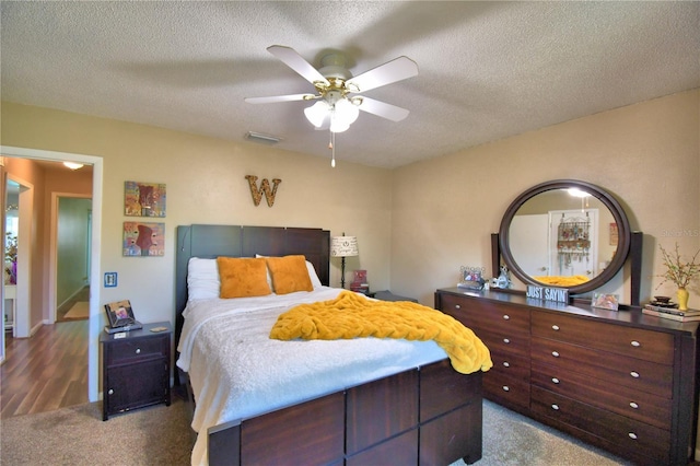 53 Paine Dr, Winter Haven, FL 33884 - bedroom featuring visible vents, carpet floors, a textured ceiling, and ceiling fan