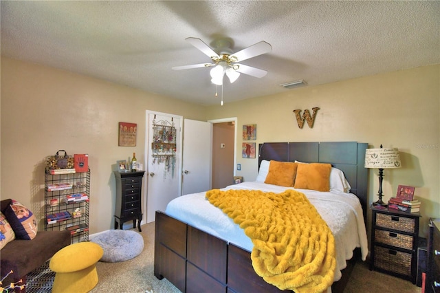 53 Paine Dr, Winter Haven, FL 33884 - bedroom with ceiling fan, a textured ceiling, visible vents, and carpet