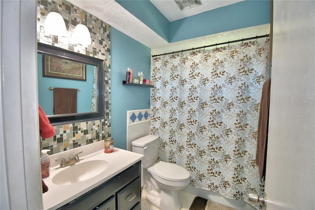 53 Paine Dr, Winter Haven, FL 33884 - full bath with tile walls, visible vents, a shower with shower curtain, and toilet
