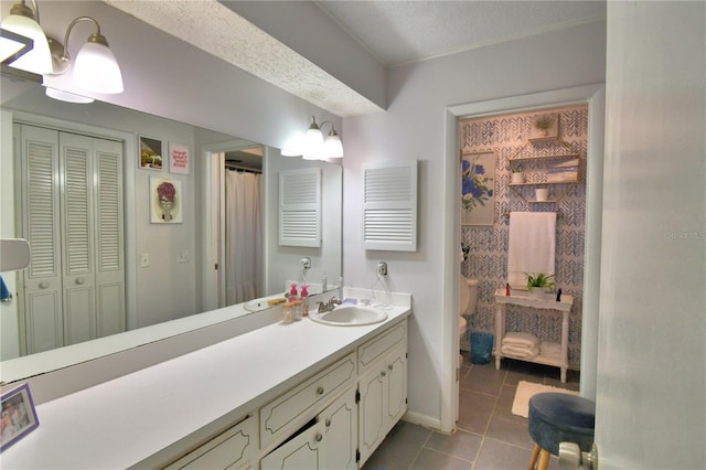 53 Paine Dr, Winter Haven, FL 33884 - bathroom featuring toilet, baseboards, tile patterned flooring, a closet, and vanity