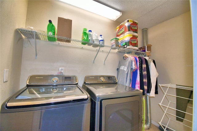 53 Paine Dr, Winter Haven, FL 33884 - washroom featuring separate washer and dryer, a textured ceiling, and laundry area