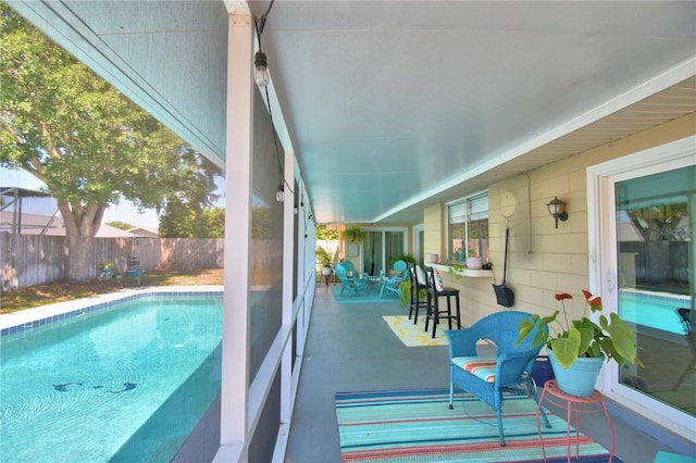 53 Paine Dr, Winter Haven, FL 33884 - view of swimming pool with outdoor dry bar, a fenced in pool, a patio area, and fence