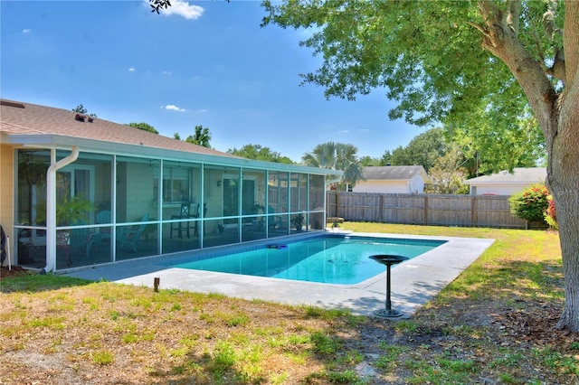 53 Paine Dr, Winter Haven, FL 33884 - view of swimming pool with a patio area, a fenced backyard, a yard, a fenced in pool, and a sunroom