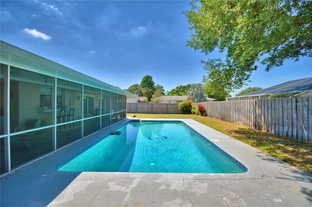 53 Paine Dr, Winter Haven, FL 33884 - view of pool with a fenced in pool, a sunroom, and a fenced backyard