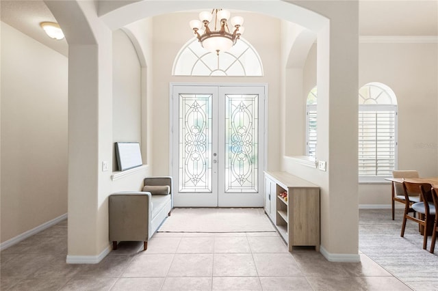 17206 Emerald Chase Dr, Tampa, FL 33647 - entrance foyer with an inviting chandelier, plenty of natural light, and light tile patterned floors