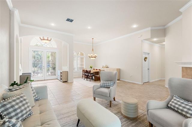 17206 Emerald Chase Dr, Tampa, FL 33647 - living room featuring light tile patterned floors, arched walkways, ornamental molding, and a chandelier