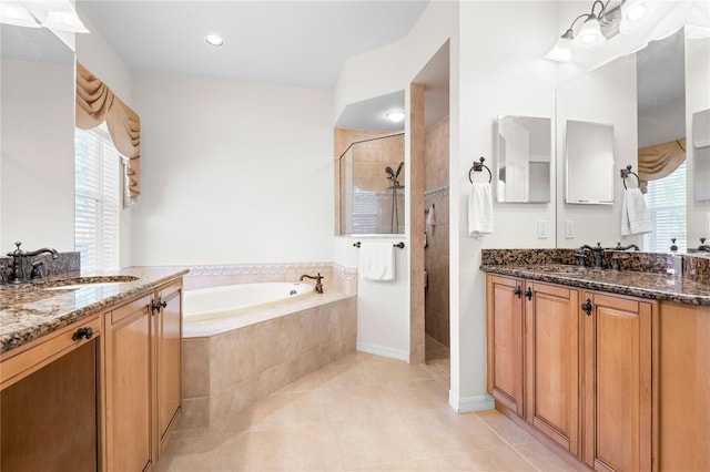 17206 Emerald Chase Dr, Tampa, FL 33647 - bathroom featuring two vanities, a tile shower, a sink, and a bath