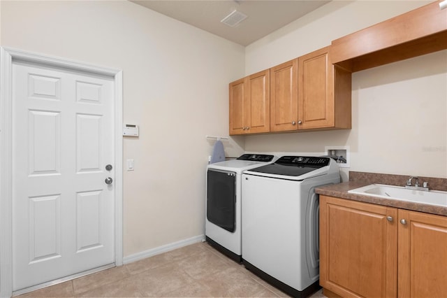 17206 Emerald Chase Dr, Tampa, FL 33647 - laundry area featuring washer and dryer, cabinet space, a sink, baseboards, and visible vents