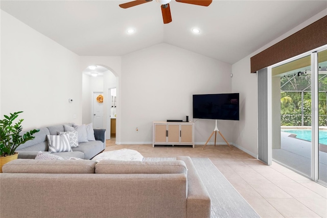 17206 Emerald Chase Dr, Tampa, FL 33647 - living area with ceiling fan, arched walkways, vaulted ceiling, recessed lighting, and light tile patterned flooring