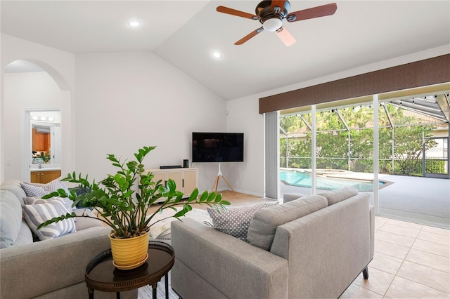 17206 Emerald Chase Dr, Tampa, FL 33647 - living area featuring lofted ceiling, recessed lighting, arched walkways, a ceiling fan, and light tile patterned floors