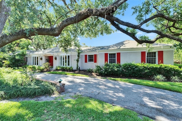 1603 Cottagewood Dr, Brandon, FL 33510 - ranch-style house featuring brick siding