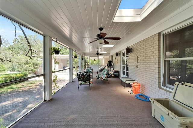 1603 Cottagewood Dr, Brandon, FL 33510 - unfurnished sunroom featuring a skylight, plenty of natural light, and ceiling fan