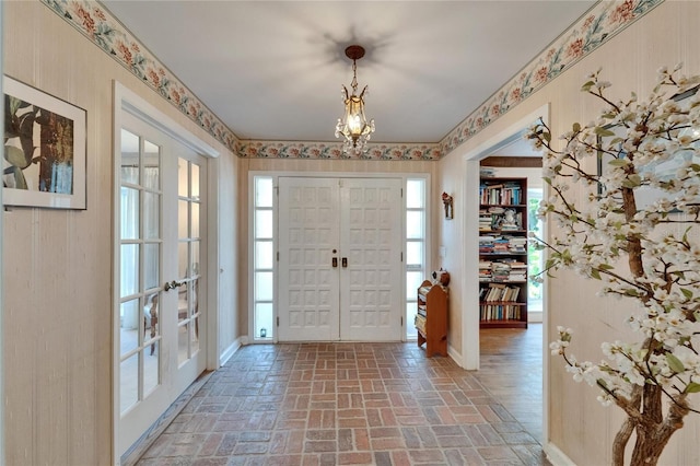 1603 Cottagewood Dr, Brandon, FL 33510 - entrance foyer with a healthy amount of sunlight, french doors, and brick floor