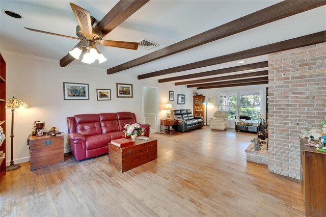 1603 Cottagewood Dr, Brandon, FL 33510 - living area with a ceiling fan, wood finished floors, baseboards, beam ceiling, and visible vents