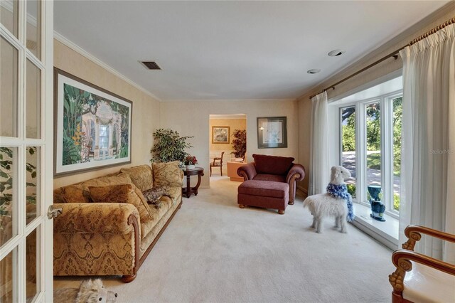 1603 Cottagewood Dr, Brandon, FL 33510 - living area featuring carpet floors, ornamental molding, and visible vents