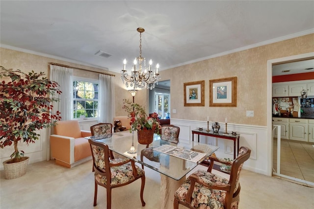 1603 Cottagewood Dr, Brandon, FL 33510 - dining space featuring wallpapered walls, visible vents, a notable chandelier, and a healthy amount of sunlight