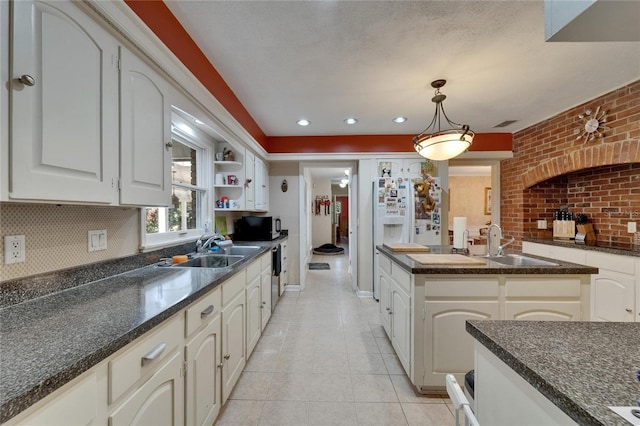 1603 Cottagewood Dr, Brandon, FL 33510 - kitchen with decorative backsplash, pendant lighting, light tile patterned flooring, and a sink