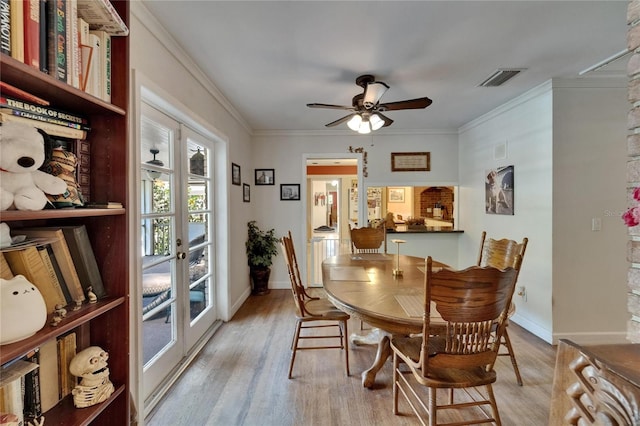 1603 Cottagewood Dr, Brandon, FL 33510 - dining room with baseboards, a ceiling fan, visible vents, and light wood-style floors