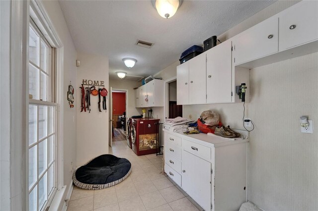 1603 Cottagewood Dr, Brandon, FL 33510 - kitchen featuring white cabinets, light countertops, visible vents, and light tile patterned flooring
