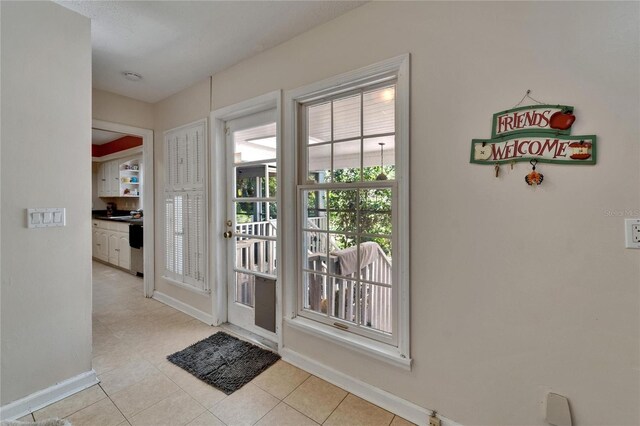 1603 Cottagewood Dr, Brandon, FL 33510 - entryway with baseboards and light tile patterned floors