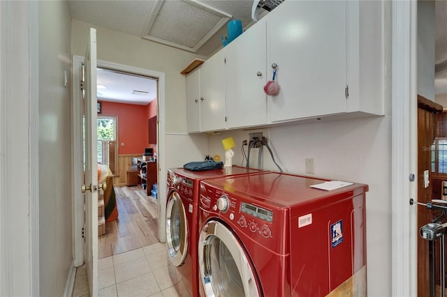 1603 Cottagewood Dr, Brandon, FL 33510 - laundry room with attic access, cabinet space, washer and clothes dryer, and light tile patterned floors