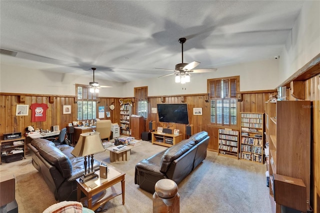 1603 Cottagewood Dr, Brandon, FL 33510 - living area with wainscoting, ceiling fan, wood walls, carpet flooring, and visible vents