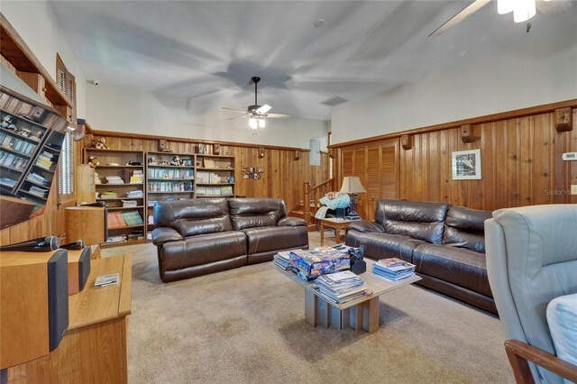 1603 Cottagewood Dr, Brandon, FL 33510 - living area featuring wooden walls, stairway, carpet flooring, and a ceiling fan