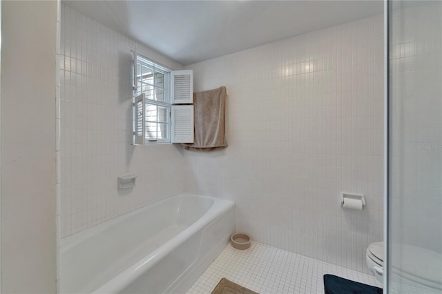 1603 Cottagewood Dr, Brandon, FL 33510 - full bath featuring tile walls, a washtub, tile patterned flooring, and toilet