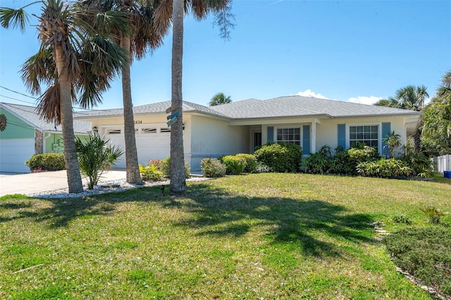 ranch-style house featuring a front yard, driveway, an attached garage, and stucco siding