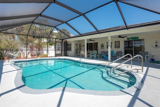 pool with a lanai, a ceiling fan, and a patio area