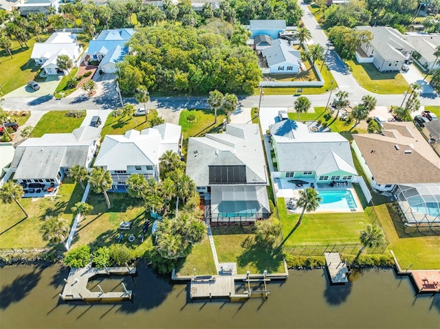 drone / aerial view featuring a residential view and a water view
