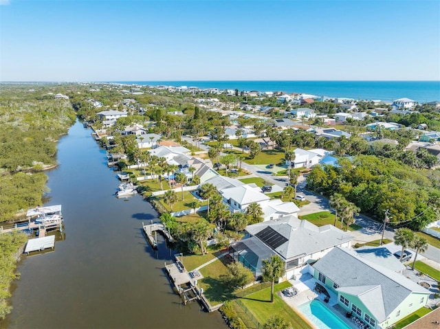 bird's eye view with a residential view and a water view